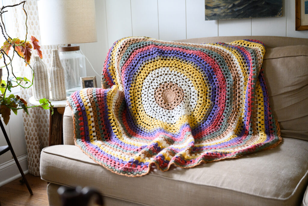 this is a picture of a knitted mandala yarn blanket